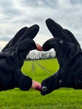 Load image into Gallery viewer, photo showing version 1 of dog walking gloves with press studs to fasten finger flaps with back ground of fields